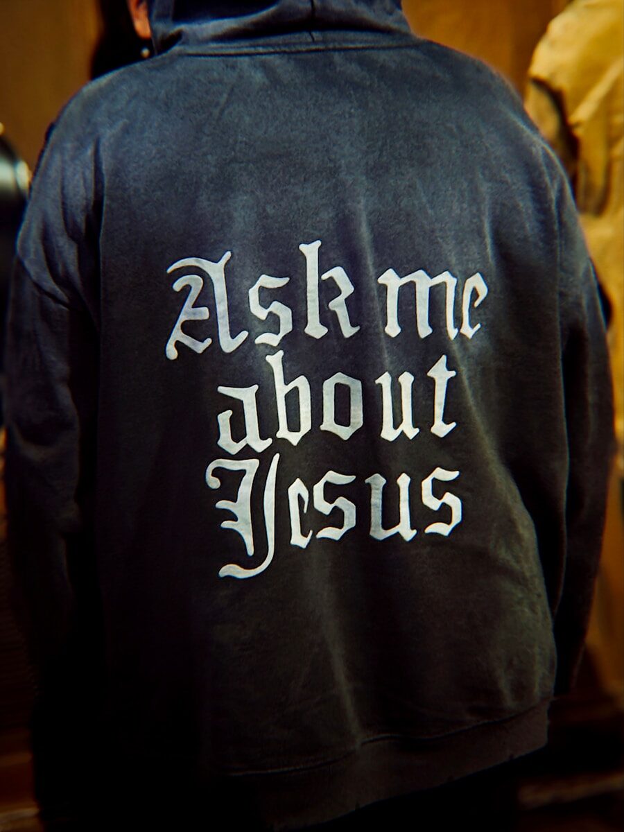 Back of hoodie with "ask me about jesus" text